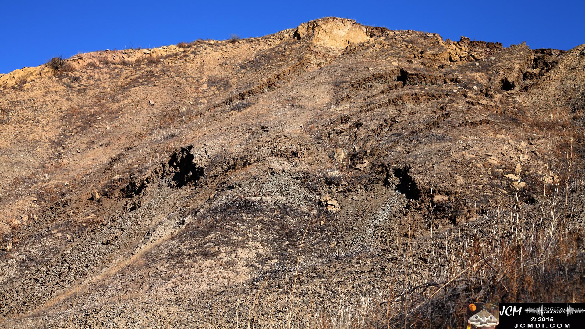 Landslide, buckled pavement, and terrain at Vasquez Canyon Road in Santa Clarita, CA filmed 11-25-2015